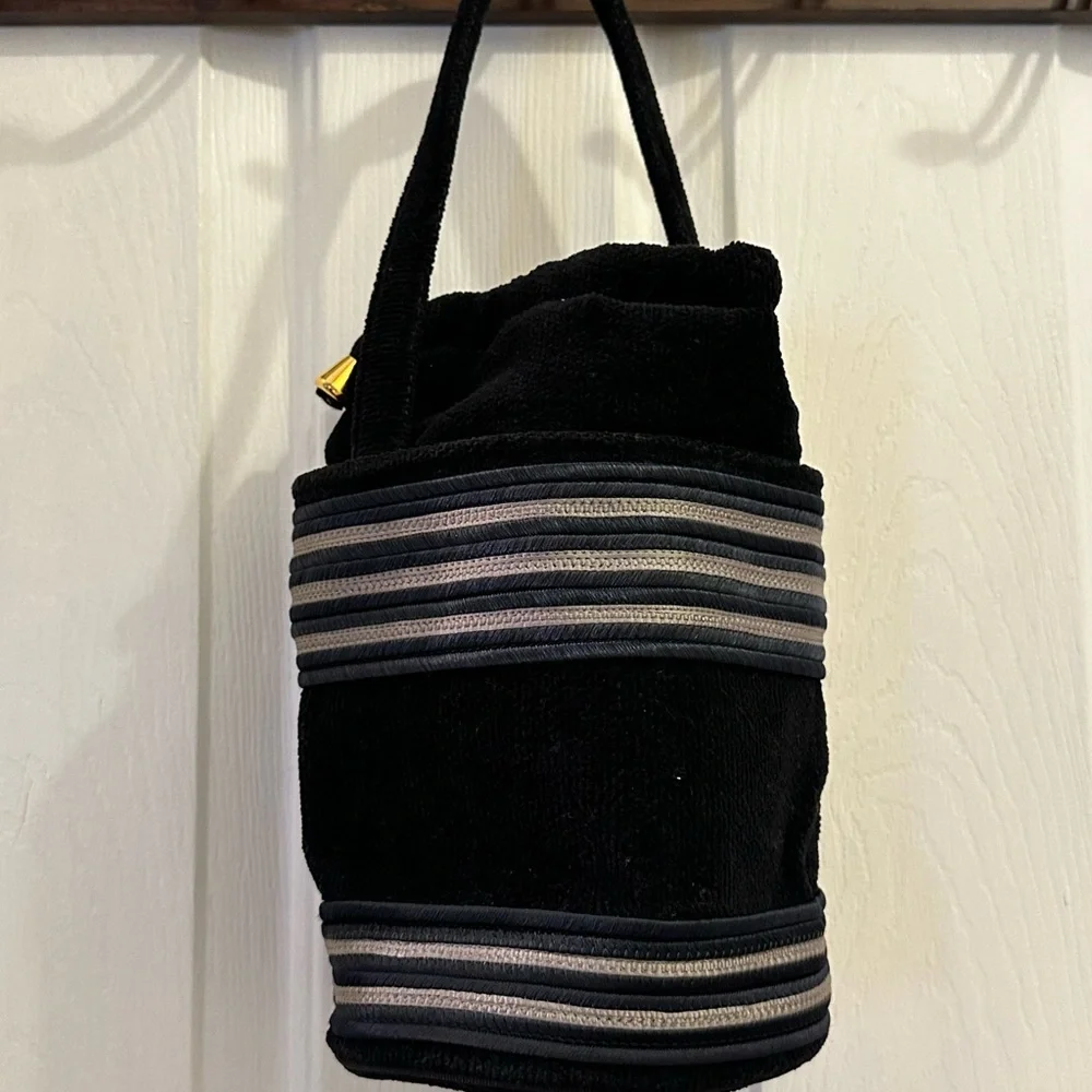 Black Satchel with Striped Accents and Plush Texture
